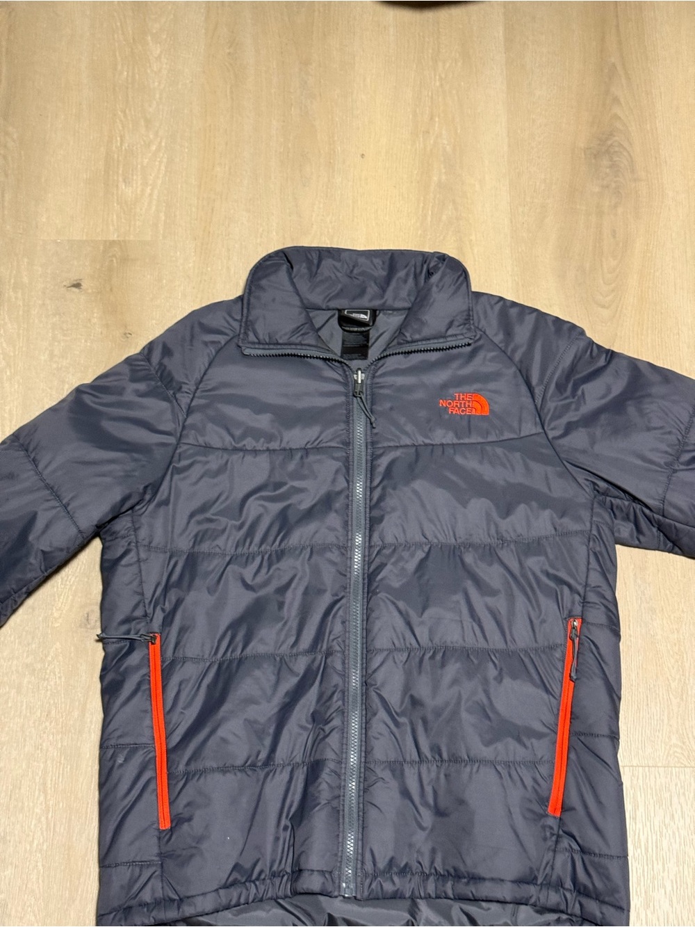 The North Face Navy Puffer Jacket with Orange Accents